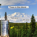 Spruce essential oil blend in front with Mt. Denali in the background. Trees in this blend are black spruce and white spruce.