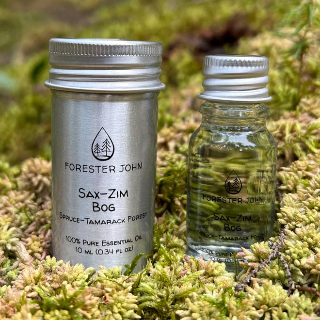 Image of Sax-Zim Bog forest blend essential oil  sitting in sphagnum moss by Forester John.
