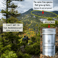 View of Adirondack forest in mountains with Forester John Essential Oil bottle. 